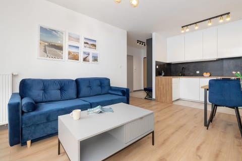 Relax in the stylish living room with a comfortable sofa and modern decor.