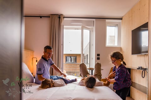 Family Quadruple Room, 2 Bedrooms, Kitchenette | Blackout drapes, iron/ironing board, free WiFi, bed sheets