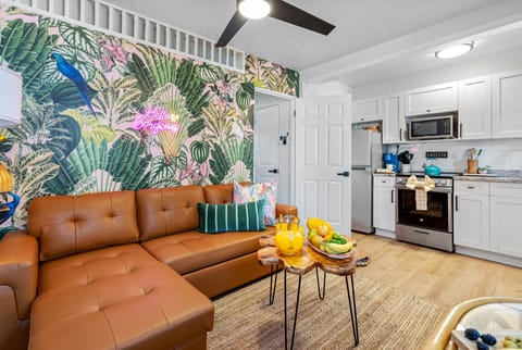 Step into the chic embrace of our Coconut Grove Tropical Haven themed living area.