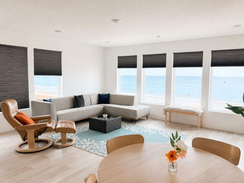 Ocean-view dining and living area with direct beach views