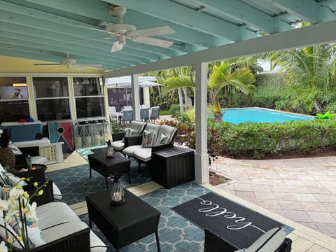 Covered patio, marble paver deck, 16x30 heated pool, floats, coolers, corn hole 