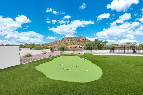 Putting green & turf area next to the pool & spa w/ amazing mountain views