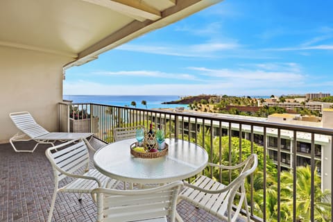 Oceanview balcony dining with sweeping blue views, gentle breezes, and a front-row seat to paradise.  This scene captures the essence of five-star relaxation—sun, sea, and sophistication in perfect harmony.