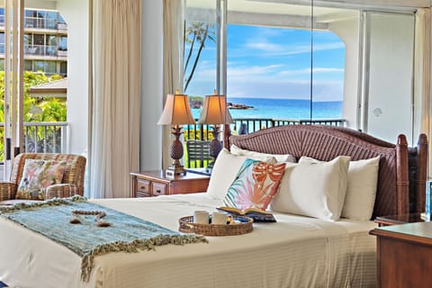 Wake up to island light and step straight out to sweeping resort views. This bright, airy bedroom features a plush king-size bed for ultimate comfort, with direct access to a private balcony that blends indoor-outdoor island living in the heart of paradise