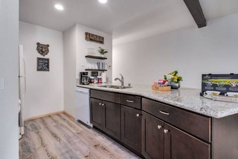 Large serving area for cooking and having a meal at the breakfast bar.