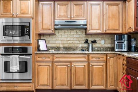 Wooden kitchen cabinets, built-in microwave and built-in oven