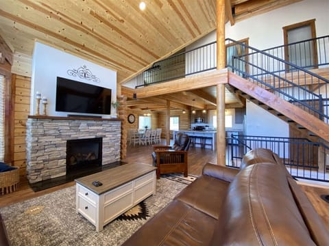 Large open concept living with cozy fireplace, perfect for relaxing or entertaining loved ones.