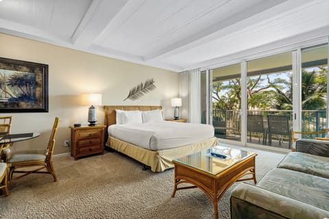 Sink into crisp linens and let tropical breezes flow through your private balcony. Your serene suite blends island-inspired decor with modern comforts, creating the perfect retreat after a day of adventure.
