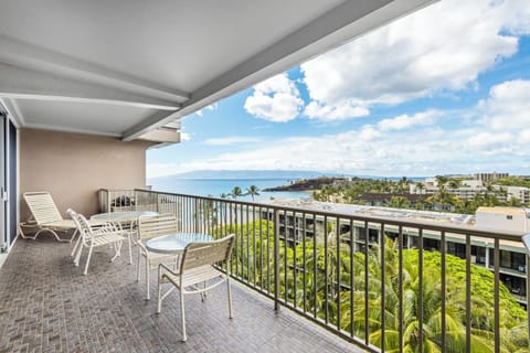 Spacious balcony overlooking lush palm trees and sparkling ocean views, where you can sip morning coffee or unwind as gentle sea breezes fill the air.