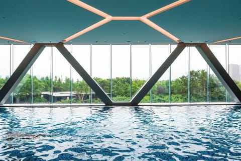 Indoor pool, open 7:00 AM to 10:00 PM, sun loungers, lifeguards on site