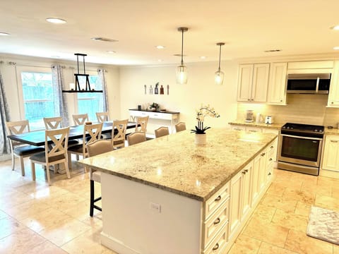 Large island and large dining table perfect for family meals and gatherings.