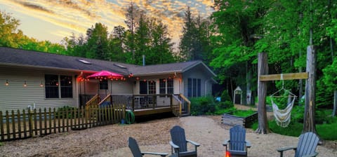 Escape to Cottage & Bay in Sister Bay, where wooded surroundings, cozy fire pit gatherings, and thoughtfully designed spaces create the perfect Door County retreat.
