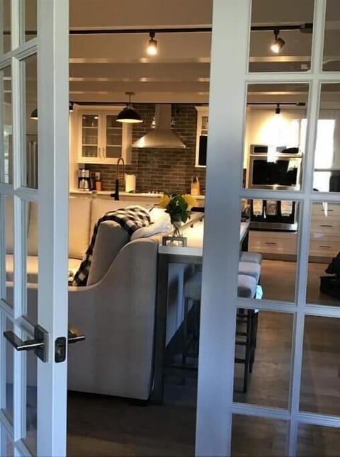 French doors separating parlor from living room.