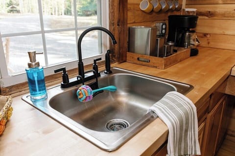 Hot water is available through spring and summer. The water is turned off in the winter. The summer camp was designed to only be open during the warmer months. For that reason the water is not available once it freezes.