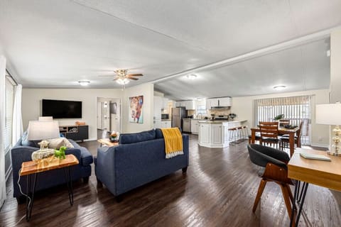 Open-concept layout connecting the living room, kitchen, and dining area