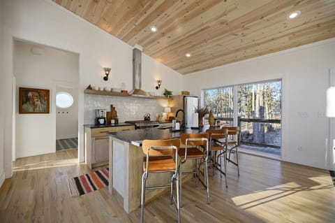 Kitchen Delight: Modern design meets nature with stunning views and stylish finishes!