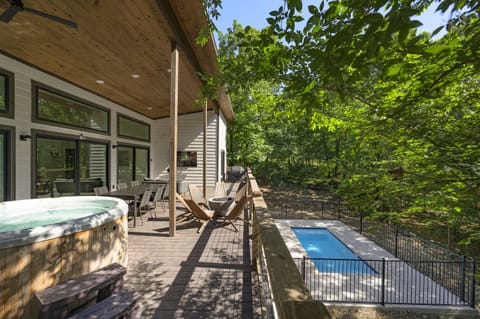 Outdoor Oasis: Relax in the hot tub with a view, or splash into the sparkling pool!