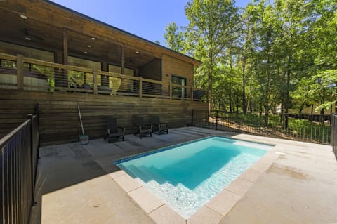 Outdoor Oasis: Dive into relaxation with a private heated pool surrounded by nature's beauty!