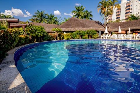 4 indoor pools, open 7:00 AM to 10:00 PM, pool umbrellas