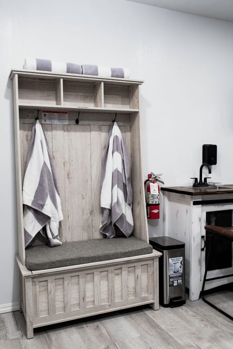 downstairs living room hall tree with hot tub towels.