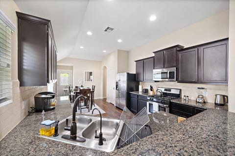 Fridge dispenses water and ice! Stainless steel appliances.