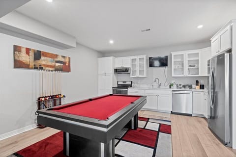 Game Space with Pool Table and Kitchen in Basement