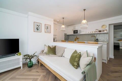 Curling up on this cozy couch to enjoy a movie marathon with friends