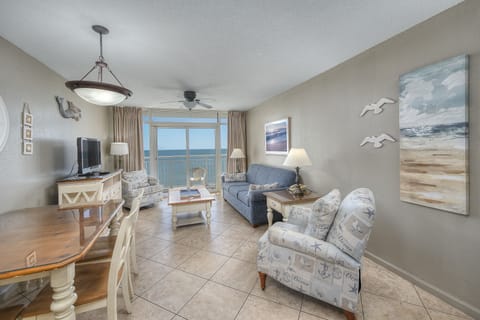 The ocean front living room is well-appointed with comfortable furnishings.