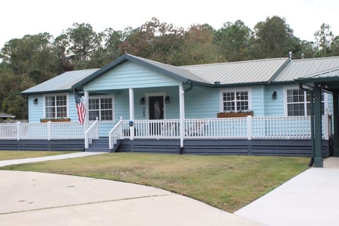 Relax under the covered porch, or enjoy the sun under the uncovered portion.