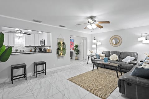 Relax in the modern and cozy living space, perfect for family gatherings or movie nights.