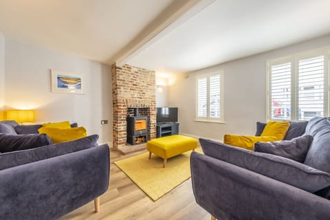 Queenie's Cottage, Wells-next-the-Sea: A colourful sitting room with plenty of natural light