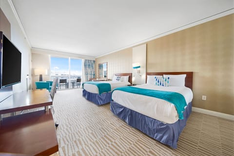 The studio is equipped with two queen-size beds, private balcony and HD TV