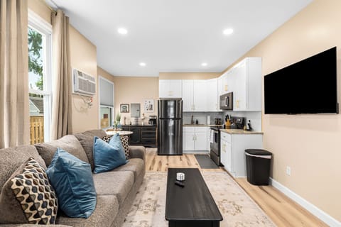 Relax in our inviting living room furnished with cozy seating and a smart TV for your entertainment.