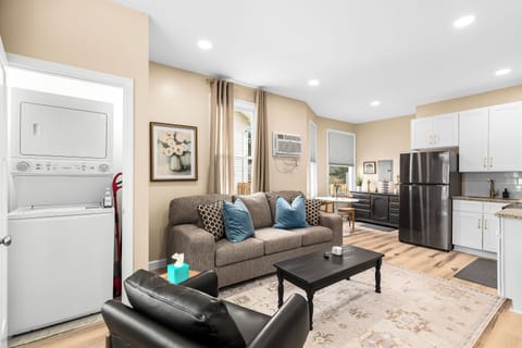 Relax in our inviting living room furnished with cozy seating and a smart TV for your entertainment.