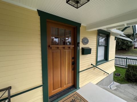 A plaque notes original1923 construction and the historic character of the home.