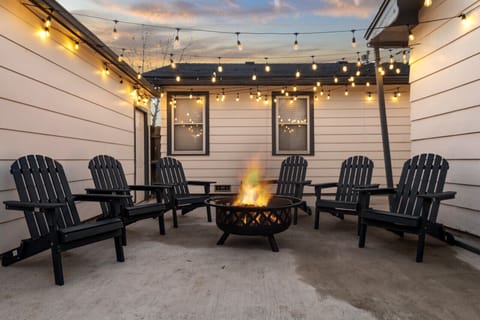 Savor a cozy evening by the firepit in the backyard, perfect for unwinding under the stars. Discover more at Blessedbnbs.net.