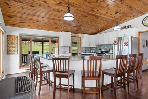 Elegant granite design countertop best for food preparation that can comfortably seat an additional 8 people!.