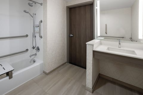 Suite, 1 King Bed with Sofa bed, Accessible Bathtub (Mobility) | Bathroom | Hair dryer, towels, soap, shampoo