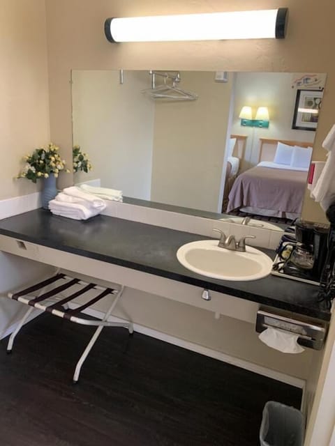 Standard Double Room, 2 Queen Beds | Bathroom | Combined shower/tub, free toiletries, hair dryer, towels