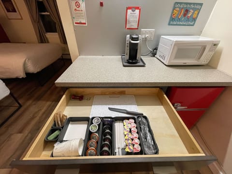 Individually decorated, desk, blackout drapes, iron/ironing board