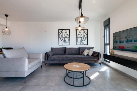 Modern living room exactly as described, offering welcoming atmosphere and seamless arrival experience.