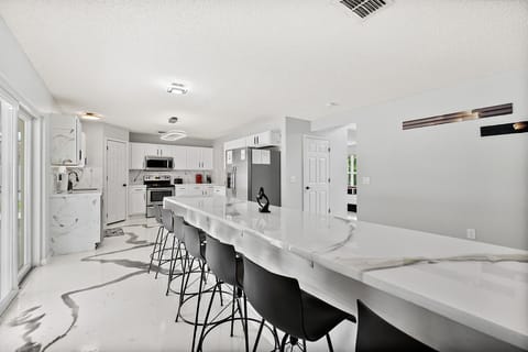 Discover the heart of the home in our modern kitchen, where epoxy designs blend style and functional