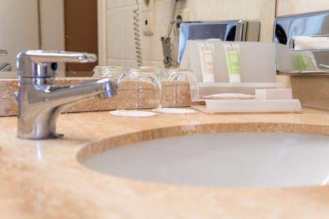 Bathtub, free toiletries, slippers, towels