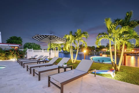 Ultimate Waterfront Luxury with Pool, Lounge Chairs, Paddle Boards & Private Dock