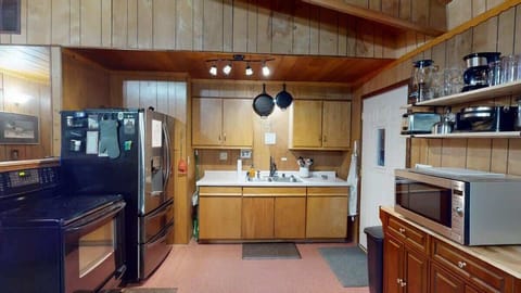 Some appliances included are a blender, coffee maker, waffle iron, and toaster. Along with dishes, silverware, cookware, and utensils.