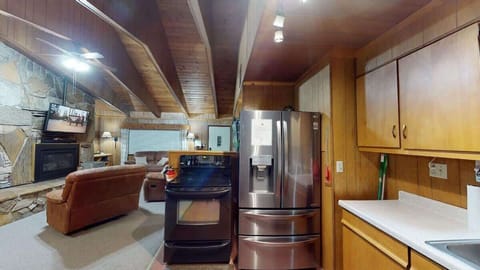 Kitchen with basic appliances and spices.