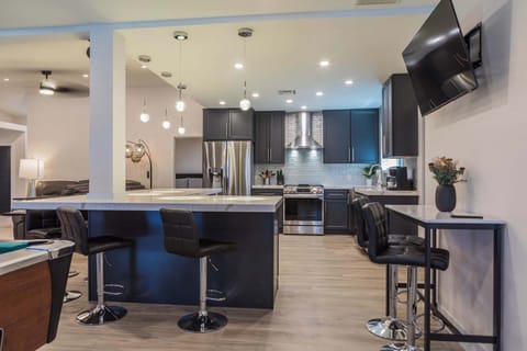 Gorgeous, open, large stocked kitchen with stainless steel appliances