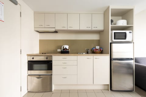 City View Studio Apartment | Private kitchenette | Microwave, stovetop, dishwasher, coffee/tea maker