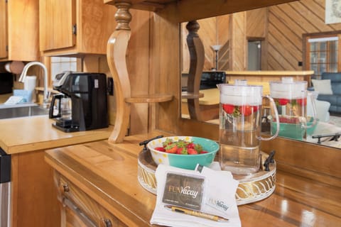Your fully equipped kitchen welcomes you with fresh strawberries and coffee, ready for cozy mornings and memorable meals together.