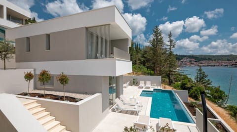 Exterior of Canzona di Mare 1 luxury Croatian vacation rental villa with private infinity pool next to the beach